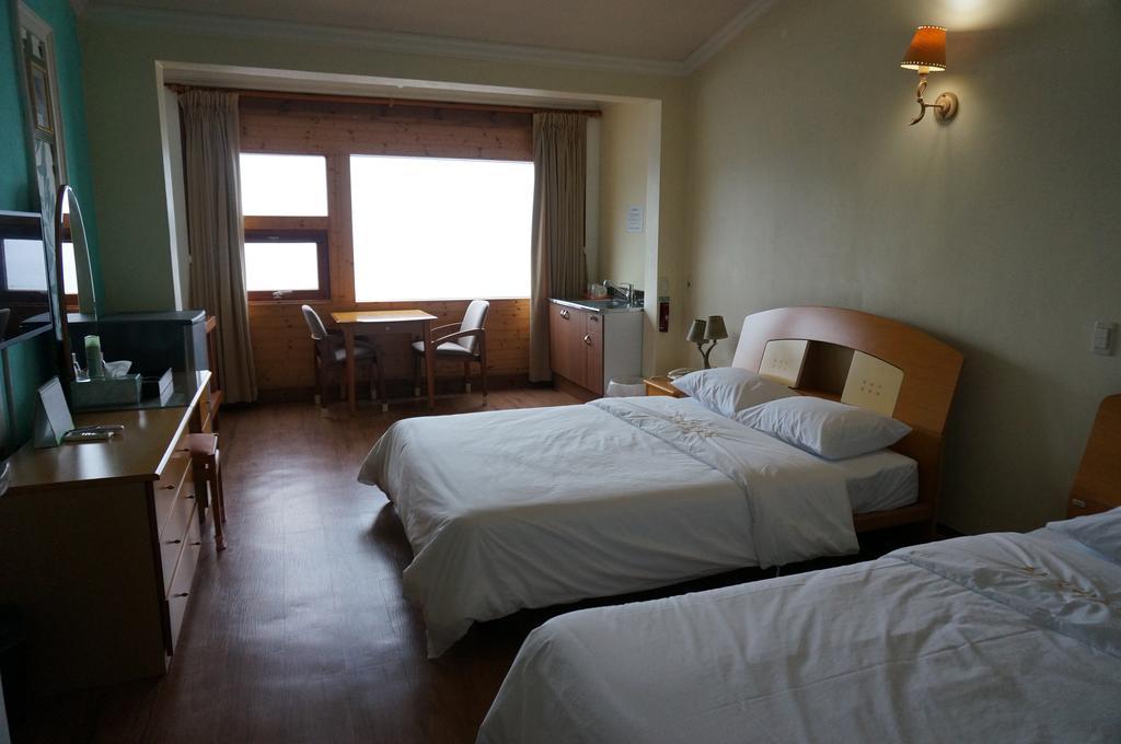 Park Beach Hotel Jeju by Rom bilde